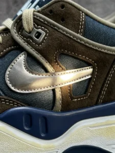 The metallic pewter Swoosh is almost reflective