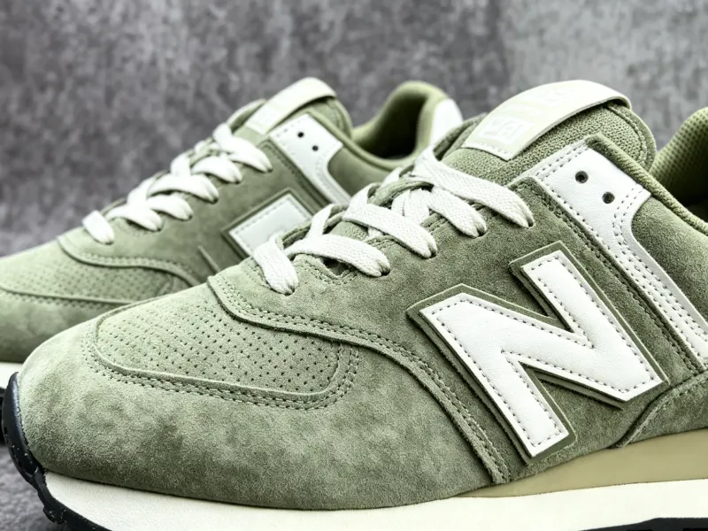 Premium suede upper and iconic New Balance N-logo detail on the 574